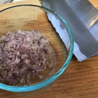 Finely diced shallot, posing with my favorite knife